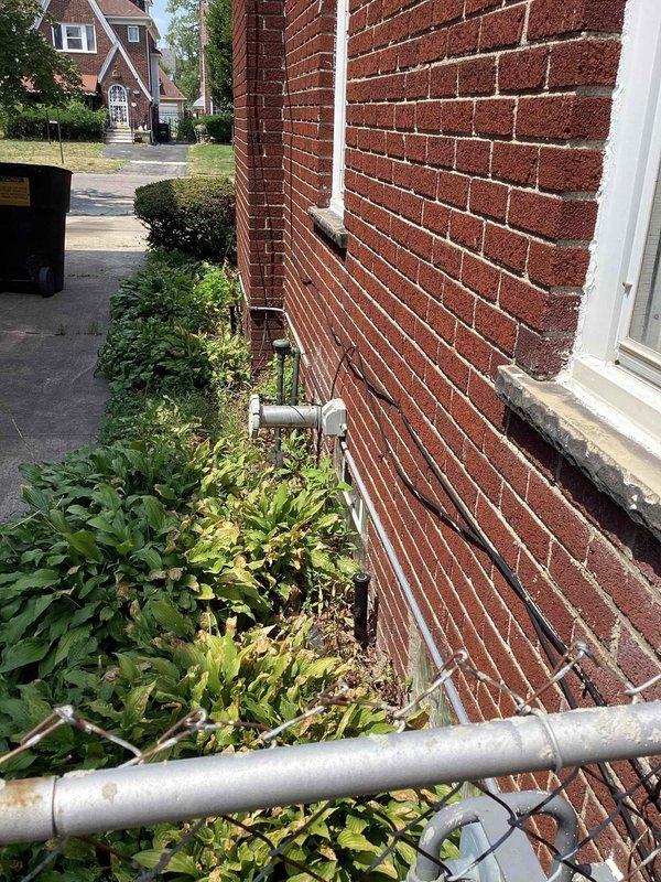 Completed electrical estimate for whole home generator replacement at brick residential property. Evaluated existing installation site along exterior wall near multiple HVAC units, assessed electrical infrastructure including conduit routing and connection points, and photographed current configuration to determine replacement specifications and installation requirements.