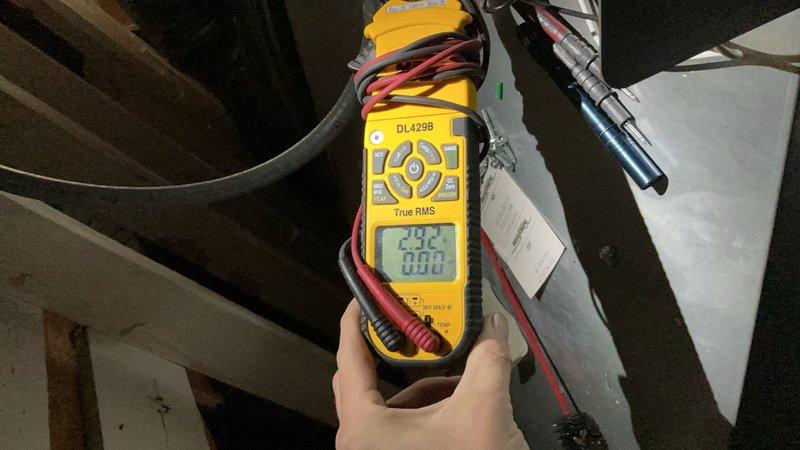 Responded to callback for re-inspection of 3-year-old air conditioning system with attic-mounted air handler and outdoor condensing unit. Performed comprehensive system evaluation addressing concerns from previous visit, including complete filter inspection and assessment of noise complaint audible from bedroom area. Verified electrical readings at air handler showing 242V and 60Hz frequency using digital multimeter. Inspected outdoor condensing unit positioned on pad with proper clearances and landscaping. Documented system condition with photos of both indoor and outdoor components. Awaiting customer response regarding consultation with Unico representative before finalizing any recommended corrective actions for noise mitigation.