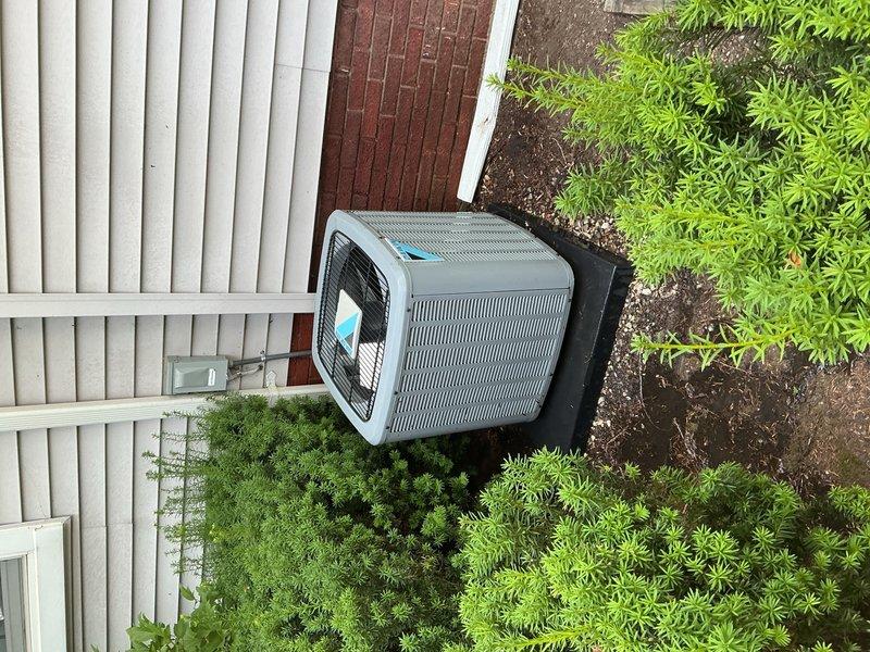 Responded to callback for re-inspection of 3-year-old air conditioning system with attic-mounted air handler and outdoor condensing unit. Performed comprehensive system evaluation addressing concerns from previous visit, including complete filter inspection and assessment of noise complaint audible from bedroom area. Verified electrical readings at air handler showing 242V and 60Hz frequency using digital multimeter. Inspected outdoor condensing unit positioned on pad with proper clearances and landscaping. Documented system condition with photos of both indoor and outdoor components. Awaiting customer response regarding consultation with Unico representative before finalizing any recommended corrective actions for noise mitigation.