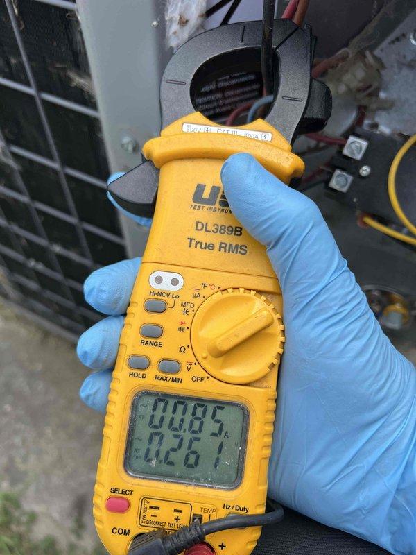Responded to no-cooling complaint on 10+ year old air conditioning system. Upon arrival, confirmed outdoor condensing unit was not operating and system was blowing warm air indoors. Performed electrical diagnostics at outdoor unit using clamp meter to measure voltage and amperage at contactor and compressor connections. Identified electrical fault preventing compressor operation. Tested power supply, capacitor values, and contactor functionality to isolate failure point in outdoor unit's electrical system.