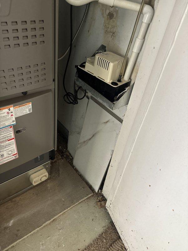 Completed installation of 4-ton air conditioning system with matching evaporator coil in rear utility location. Applied for mechanical and electrical permits prior to installation, then reconnected all electrical connections, refrigerant lines, and condensate drainage system with pump assembly. System was tested and left operational with all components properly labeled and secured per code requirements.