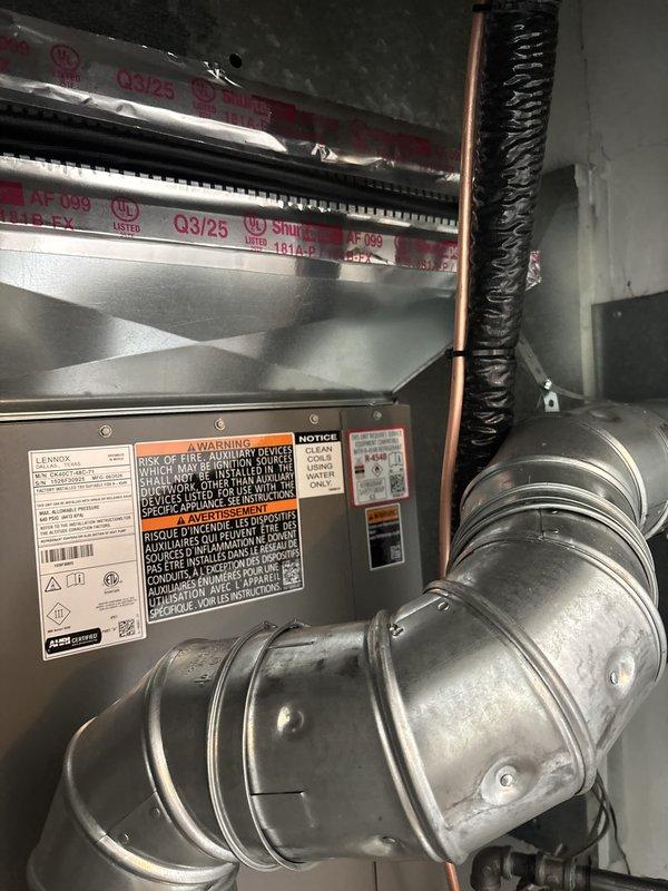 Completed installation of 4-ton air conditioning system with matching evaporator coil in rear utility location. Applied for mechanical and electrical permits prior to installation, then reconnected all electrical connections, refrigerant lines, and condensate drainage system with pump assembly. System was tested and left operational with all components properly labeled and secured per code requirements.