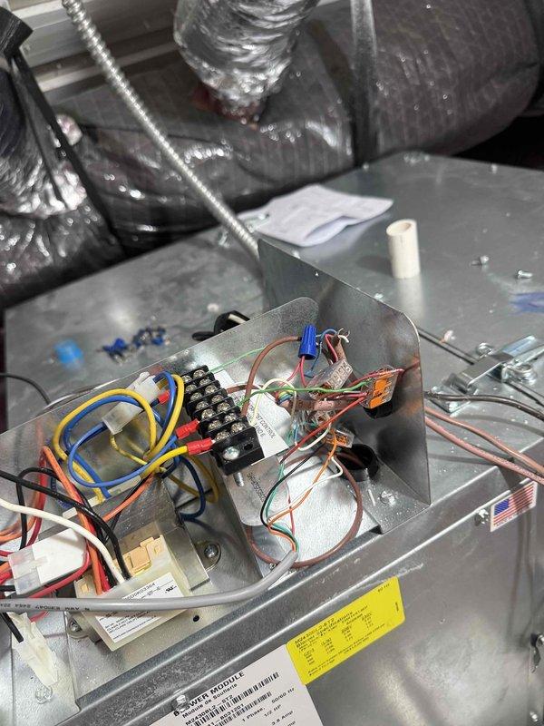 Performed comprehensive diagnostic inspection on Unico high velocity central air conditioning system experiencing reduced cooling capacity and recent breaker trip. Accessed air handler unit, inspected electrical components including capacitors, terminal blocks, relay controls, and all wire connections for signs of failure or overheating. Evaluated system operation under load, checked amperage draws, and verified proper electrical connections throughout control panel. Assessed condensate drain system and provided recommendations for float switch installation to prevent future water damage and ensure proper drainage protection.