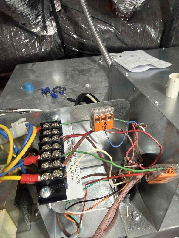 Performed comprehensive diagnostic inspection on Unico high velocity central air conditioning system experiencing reduced cooling capacity and recent breaker trip. Accessed air handler unit, inspected electrical components including capacitors, terminal blocks, relay controls, and all wire connections for signs of failure or overheating. Evaluated system operation under load, checked amperage draws, and verified proper electrical connections throughout control panel. Assessed condensate drain system and provided recommendations for float switch installation to prevent future water damage and ensure proper drainage protection.
