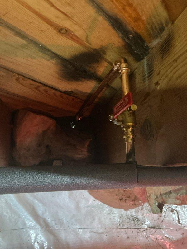 # Plumbing Service Completed

Responded to service call for corroded copper refrigerant lines on exterior HVAC system. Upon inspection, identified significant copper oxidation and verdigris formation at multiple soldered joints and along exposed pipe surfaces, indicating prolonged moisture exposure. Replaced deteriorated copper line set with new refrigerant-grade copper piping, ensuring proper brazing techniques and leak-free connections.

Additionally addressed plumbing issue in attic space where copper water supply line showed signs of leakage contributing to moisture damage on surrounding wooden joists and subflooring. Installed new brass shutoff valve on copper supply line and secured proper foam insulation to prevent future condensation issues. Verified no active leaks present after installation and confirmed adequate ventilation in attic space to minimize future moisture accumulation and mold growth on structural components.