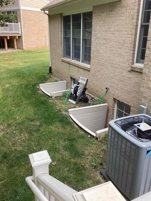 Completed electrical estimate for new whole home generator installation at residential property. Assessed exterior installation location near existing AC condenser unit, documented utility line markings and drainage infrastructure, and evaluated electrical service requirements for permanent standby generator system integration with home's electrical panel.