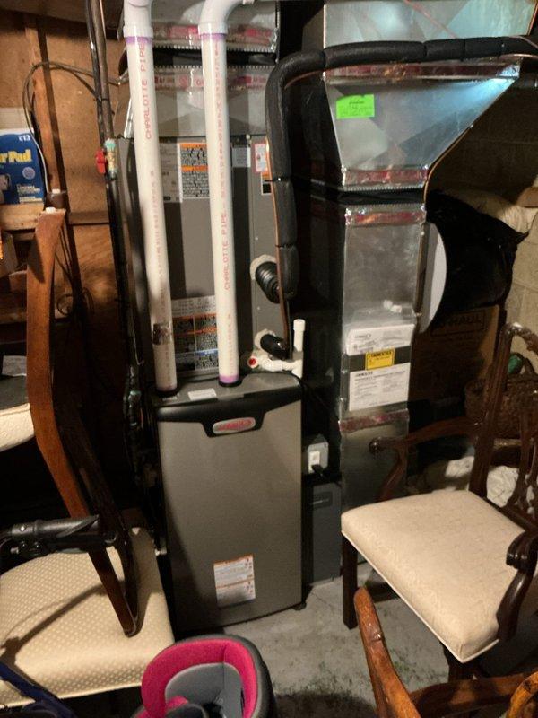 Responded to no cooling complaint on 1-year-old Lennox system located in basement. Upon arrival, found frozen evaporator coil at air handler and thermostat displaying Alarm ID 200 "G+ Position Circuit Fault" error. Inspected system and determined damper position sensor malfunction was causing improper airflow control, contributing to coil freeze-up. Allowed coil to thaw completely, verified condensate drainage was functioning properly, and cleared fault code from thermostat interface. Tested damper operation and confirmed proper movement throughout full range. Cycled system through complete cooling cycle to verify proper operation, adequate airflow, and appropriate temperature differential across coil. System restored to normal cooling operation with no further fault codes present.