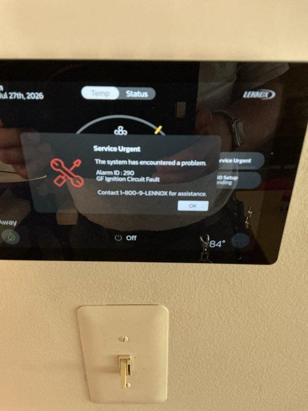 Responded to no cooling complaint on 1-year-old Lennox system located in basement. Upon arrival, found frozen evaporator coil at air handler and thermostat displaying Alarm ID 200 "G+ Position Circuit Fault" error. Inspected system and determined damper position sensor malfunction was causing improper airflow control, contributing to coil freeze-up. Allowed coil to thaw completely, verified condensate drainage was functioning properly, and cleared fault code from thermostat interface. Tested damper operation and confirmed proper movement throughout full range. Cycled system through complete cooling cycle to verify proper operation, adequate airflow, and appropriate temperature differential across coil. System restored to normal cooling operation with no further fault codes present.