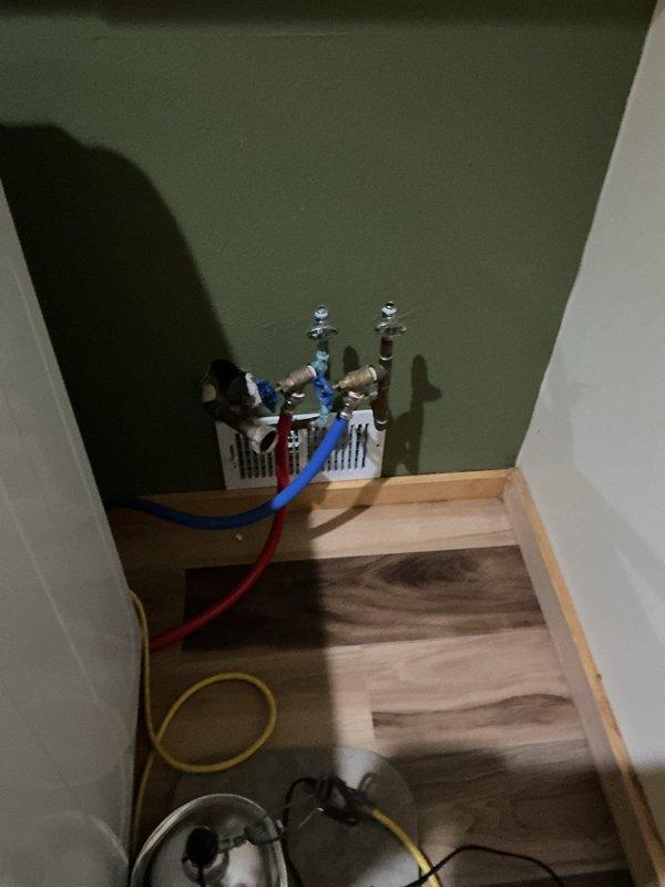 Installed customer-supplied laundry tray pump in utility room adjacent to garage for laundry tub sink drainage. Connected pump assembly using 3/4" swing check valve and 3/4" nipple as specified. Completed all plumbing connections to existing water supply lines and verified proper pump operation according to manufacturer specifications for Model 3-12-19 unit.