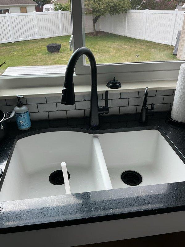 Responded to a clogged double-basin kitchen sink affecting both the garbage disposal side and regular drain side in a 40-year-old home. Performed diagnostic inspection of the drainage system, cleared blockage from the affected drains, and verified proper water flow through both basins and the garbage disposal unit. Tested the complete plumbing assembly including P-traps and connecting pipes to ensure full functionality, with no other drainage issues identified elsewhere in the property.