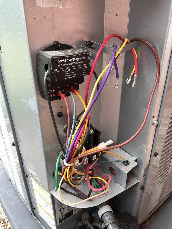 Responded to service call for 2-3 year old residential AC unit with condenser fan blades that stopped spinning abruptly and produced buzzing noise. Upon arrival, inspected outdoor condenser unit and electrical control panel in basement. Diagnosed failed run capacitor preventing fan motor from starting while compressor attempted to run, causing buzzing sound. Replaced defective dual run capacitor, verified proper voltage and amperage readings at compressor and fan motor terminals, and tested system operation through complete cooling cycle. Unit restored to normal operation with condenser fan spinning freely and compressor running quietly.