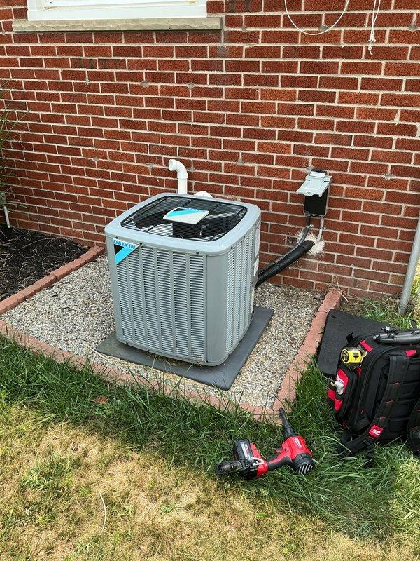 Responded to service call for 2-3 year old residential AC unit with condenser fan blades that stopped spinning abruptly and produced buzzing noise. Upon arrival, inspected outdoor condenser unit and electrical control panel in basement. Diagnosed failed run capacitor preventing fan motor from starting while compressor attempted to run, causing buzzing sound. Replaced defective dual run capacitor, verified proper voltage and amperage readings at compressor and fan motor terminals, and tested system operation through complete cooling cycle. Unit restored to normal operation with condenser fan spinning freely and compressor running quietly.