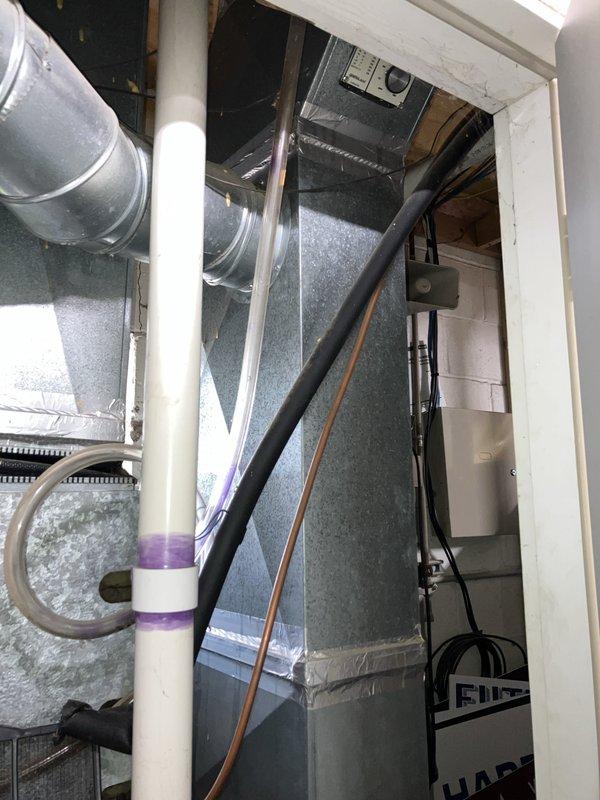 Conducted on-site assessment for air conditioning unit replacement. Evaluated existing HVAC system installation located in mechanical space, including air handler unit with associated ductwork and electrical connections. Inspected electrical panel to verify circuit breaker capacity and available power supply for potential new equipment installation. Documented current system configuration, including insulated supply ductwork, PVC condensate drain lines, and flexible return air connections. Photographed electrical infrastructure and existing HVAC components to provide accurate equipment specifications and installation requirements for replacement estimate.