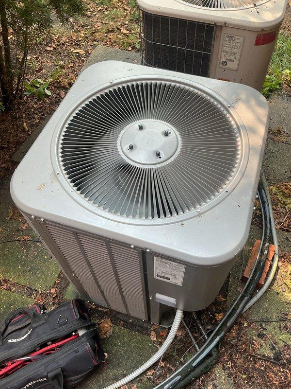 Completed comprehensive Gold AC Inspection on two 5-year-old Lennox air conditioning systems serving a multi-level residence. Performed thorough evaluation of both outdoor condenser units, inspecting refrigerant lines, electrical connections, and overall equipment condition. Both systems were operational at time of service, with units showing normal wear consistent with age and outdoor exposure. Documented equipment condition through detailed photography for maintenance records.