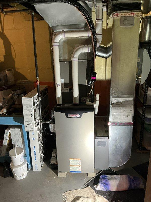 Completed comprehensive Gold AC inspection on 1-year-old residential HVAC system with Lennox furnace and outdoor mini-split unit. Performed thorough visual assessment of all accessible components including furnace, air handler, venting systems, and ductwork connections. Verified proper operation of all equipment, inspected PVC exhaust and intake venting for secure connections and proper drainage, examined flexible ductwork for integrity, and checked wall-mounted inspection port and associated electrical connections. System found to be operating within normal parameters with no immediate service needs identified. All mechanical components, safety controls, and ventilation systems functioning as designed.