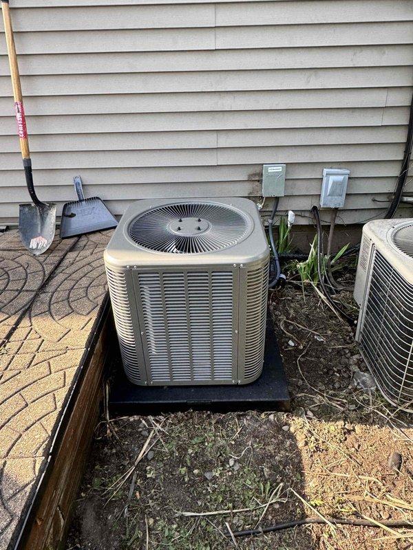 Completed full installation of 2-ton air conditioning system with new evaporator coil in rear yard location. Installation included mechanical and electrical connections, reconnection of condensate pump, thermostat, and refrigerant line flush. New condenser unit positioned on platform pad against exterior wall with proper clearances maintained. System startup performed with temperature verification confirming 128.1°F readings at appropriate test points. All components operational and permit documentation submitted as required.