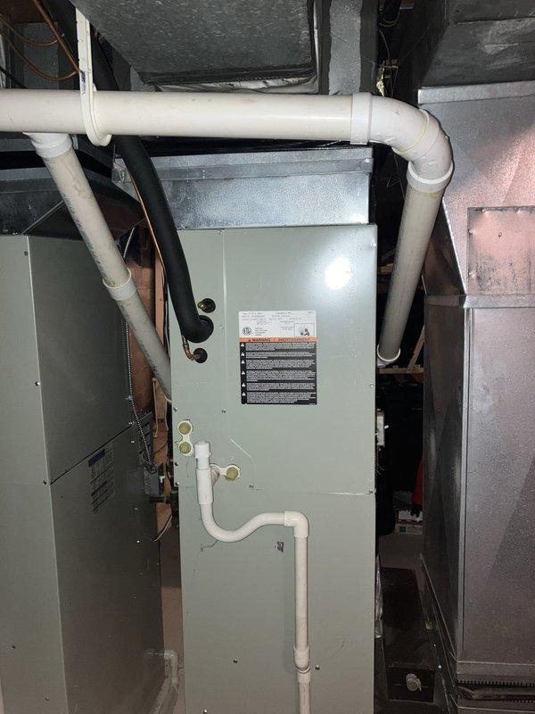 Provided comprehensive estimate for complete HVAC system replacement in basement installation, including non-operational 14-year-old air conditioning unit and natural gas furnace. Assessed existing American Standard equipment configuration, evaluated current ductwork, PVC condensate drainage system, copper refrigerant lines, and electrical connections. Documented equipment specifications and prepared replacement recommendations for both cooling and heating components to restore full system functionality.