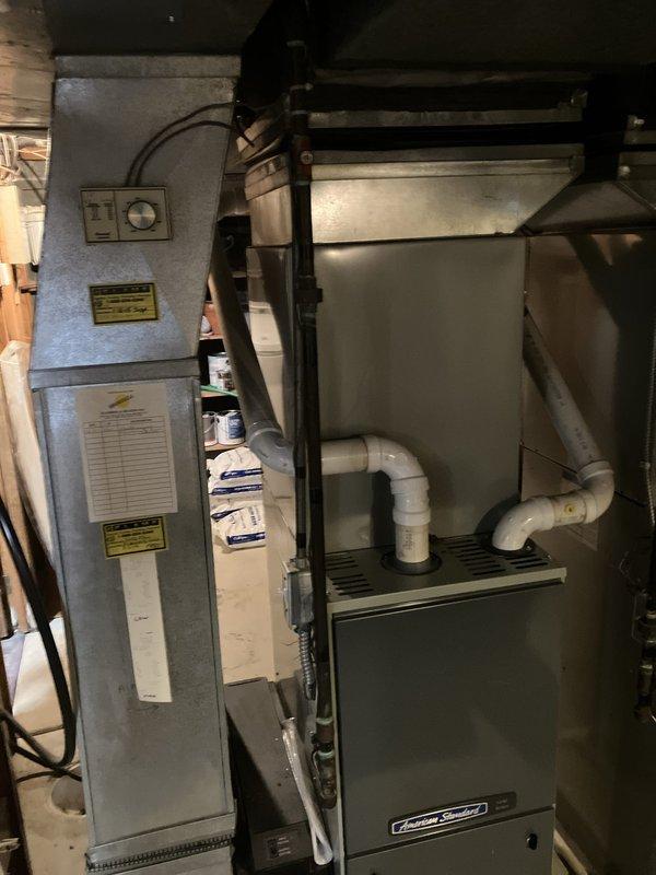 Provided comprehensive estimate for complete HVAC system replacement in basement installation, including non-operational 14-year-old air conditioning unit and natural gas furnace. Assessed existing American Standard equipment configuration, evaluated current ductwork, PVC condensate drainage system, copper refrigerant lines, and electrical connections. Documented equipment specifications and prepared replacement recommendations for both cooling and heating components to restore full system functionality.