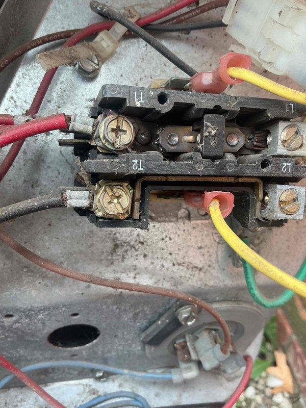 Responded to no cooling complaint on 10-year-old AC system with condenser running continuously. Upon inspection, found debris accumulation in equipment compartment and examined electrical connections at terminal block showing signs of age and wear. Assessed wiring connections at terminals 11, 12, 71, and 72, along with associated control circuits, and inspected condensate drain line and flexible ductwork connections in basement installation.