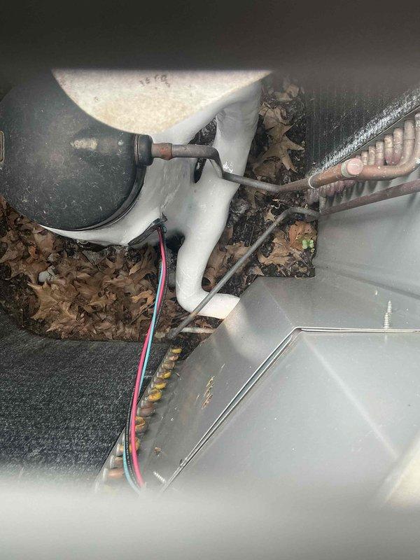 Responded to no cooling complaint on 10-year-old AC system with condenser running continuously. Upon inspection, found debris accumulation in equipment compartment and examined electrical connections at terminal block showing signs of age and wear. Assessed wiring connections at terminals 11, 12, 71, and 72, along with associated control circuits, and inspected condensate drain line and flexible ductwork connections in basement installation.
