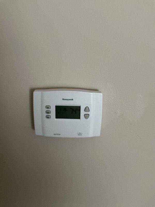 Completed air conditioning inspection on two AC units located in basement. Assessed existing equipment condition, age, and operational status to provide comprehensive full system replacement estimates for both units. Documented current thermostat configuration and system controls as part of evaluation process.