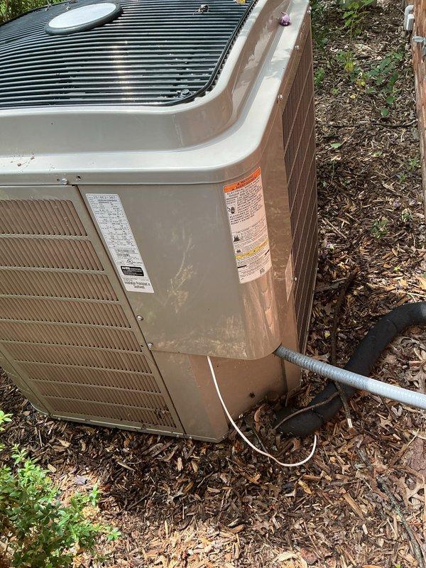 Completed comprehensive Gold Plan preventive maintenance on three 7-8 year old air conditioning systems including one garage unit, one exterior ground-level unit, and one rooftop unit requiring ladder access. Performed full system inspections on all three condensing units including visual examination of cabinet conditions, refrigerant line insulation integrity, electrical connections, and component wear. Verified proper operation of condenser fan motors, checked compressor functionality, and confirmed adequate airflow through coil assemblies. Inspected condensate drainage systems and PVC discharge lines for proper flow and blockages. All three systems operating within normal parameters with no deficiencies noted. Units showed typical weathering consistent with outdoor exposure and age but remain in serviceable condition. Refrigerant lines properly insulated with appropriate line set protection observed on exterior units. All safety labels and manufacturer specifications visible and int