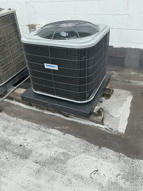 Completed full HVAC system installation including new outdoor condensing unit positioned on concrete pad against exterior wall. Unit was properly mounted, refrigerant lines connected, and system charged to manufacturer specifications. Comprehensive system diagnostics performed using calibrated testing equipment, confirming optimal operating temperatures, pressures, and performance parameters across all components.