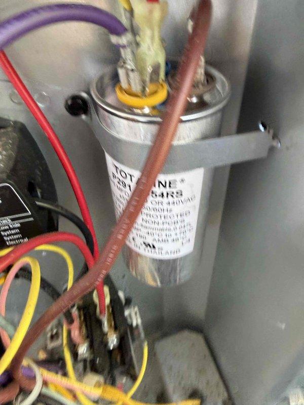 Responded to service call for 8-year-old attic-mounted air conditioning system with inadequate cooling performance. Accessed unit through hall closet entry point and performed comprehensive system diagnostics. Inspected electrical components including capacitor and contactor assembly, verified proper wire connections and voltage specifications at control panel. Evaluated outdoor condensing unit condition, checked refrigerant levels, and assessed overall system operation. System restored to proper cooling function.
