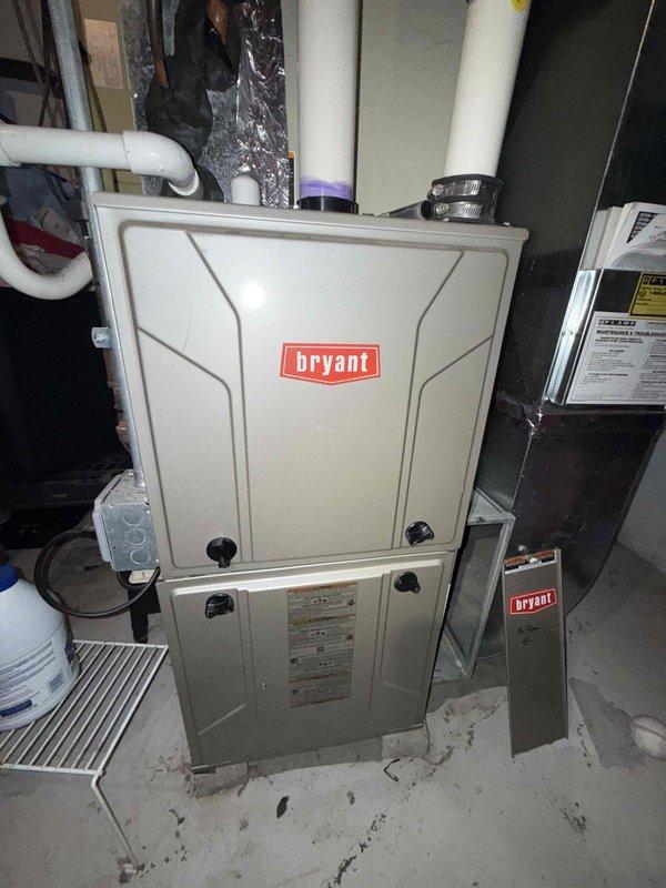 Completed comprehensive Gold AC inspection on 10+ year old Bryant HVAC system located in basement. Performed electrical diagnostics using digital multimeter, measuring capacitor performance and verifying proper voltage readings on all components. Inspected furnace unit, condensate pump assembly, PVC venting system, and associated ductwork. All equipment found to be operational with measurements within acceptable parameters for system age.
