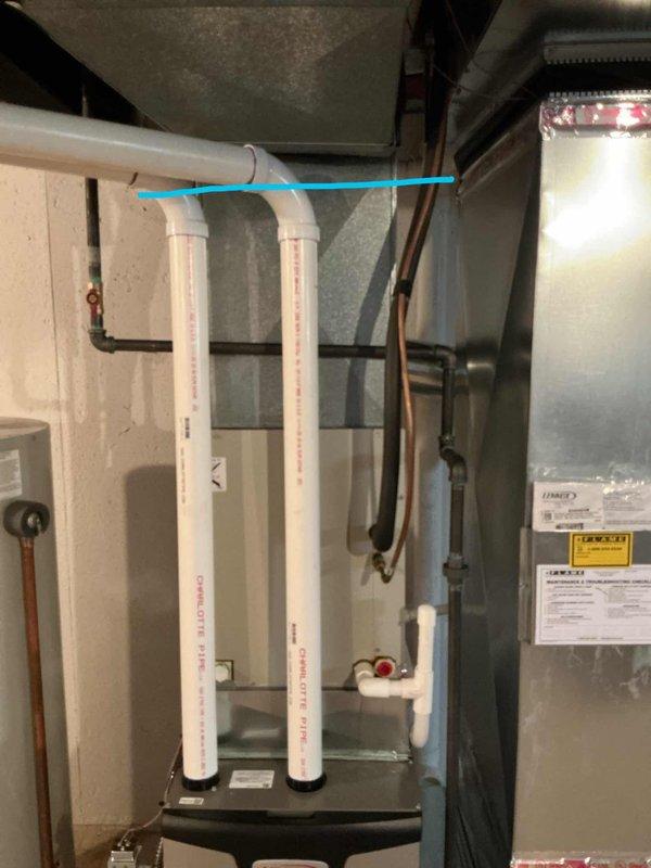 Performed comprehensive Gold AC inspection on 10+ year old air conditioning system located in basement. Evaluated existing HVAC equipment including condensate drainage system with PVC piping and assessed overall system condition. Documented current thermostat (Sensi digital programmable unit set at 70°F) and photographed equipment configuration for replacement estimate preparation.