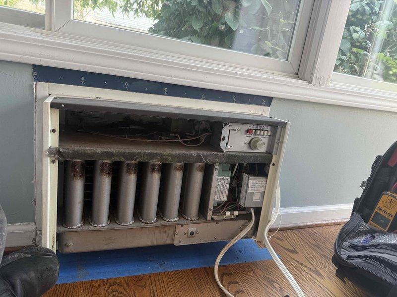 Responded to customer request to verify operational status of infrequently used porch room air conditioning unit. Performed system inspection and operational test on 18-year-old AC system. Verified unit powers on properly, compressor engages, and system effectively cools the main living area. Inspected wall-mounted air handler with exposed internal components, noting heat exchanger coils and control panel functionality. Checked attic-mounted ventilation equipment and structural mounting integrity. Confirmed no abnormal symptoms, unusual noises, or performance issues present. System operating within normal parameters for age and application.