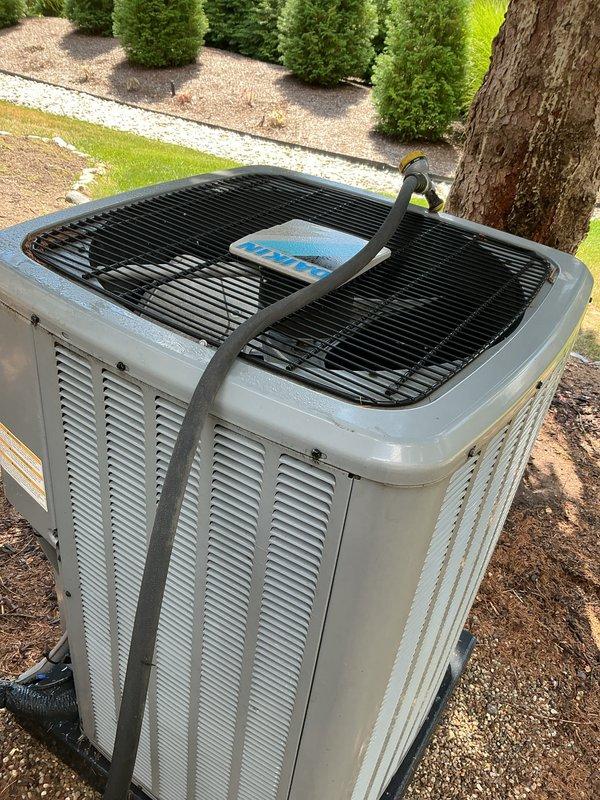Completed comprehensive Gold AC inspection on two residential air conditioning systems, a 7-year-old unit and a 1-year-old unit, with air handler/coil located in basement. Performed thorough evaluation of both outdoor condenser units, verifying proper operation, inspecting louvered panels for adequate ventilation, checking condenser fan operation and protective grilles, and assessing overall equipment condition. Both systems found to be in working order with no immediate service needs identified at time of inspection.
