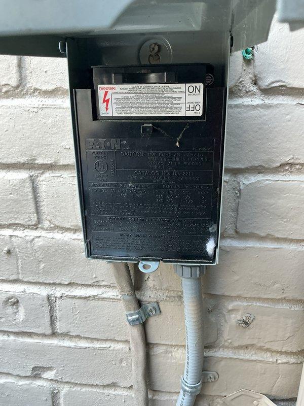 Completed comprehensive tune-up and inspection of 2018 AC system located in basement. Inspected exterior disconnect box, verified proper electrical connections and confirmed operational status. Checked ventilation register and ductwork connections, documented equipment condition with photos showing normal wear consistent with age.