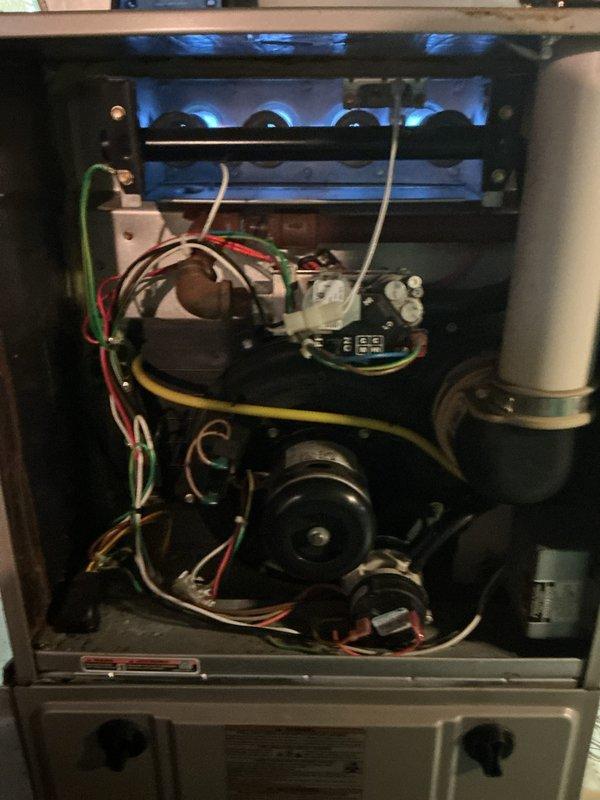 Completed comprehensive tune-up service on residential forced-air furnace and air conditioning system located in basement. Performed full inspection of furnace burner assembly, heat exchanger, blower motor, electrical controls, and gas connections; verified proper operation of all safety systems and cleaned burner compartment. Inspected AC unit including refrigerant levels, electrical components, and condensate drainage; both systems tested and confirmed operating within manufacturer specifications.
