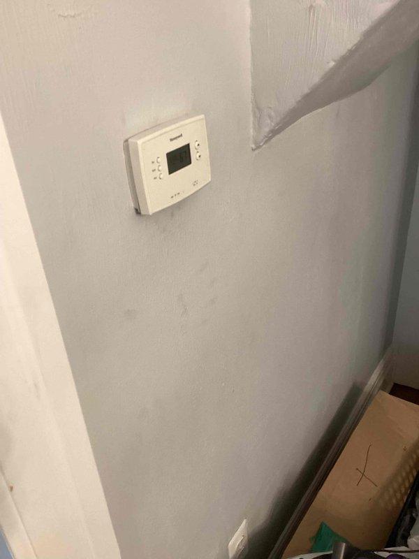 Responded to service call for no airflow from vents and lack of cooling. Performed system evaluation of existing air conditioning unit with unknown age and heating capability status. Assessed electrical panel configuration and thermostat operation. Documented equipment conditions and provided replacement estimate for HVAC system upgrade.