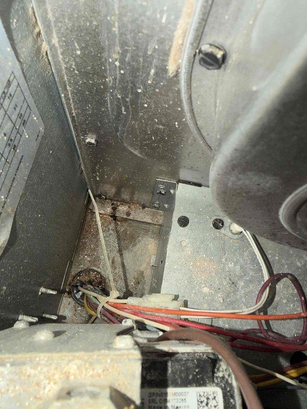 Responded to service call for plugged condensation pump on 6-year-old forced air AC system located in laundry room. Upon inspection, found condensate pump clogged and preventing proper drainage. Cleared blockage from pump and verified proper operation. Noted significant dust and debris accumulation inside air handler cabinet and organic debris around outdoor condensing unit near vegetation. Cleaned accessible areas and tested system operation. Unit cooling properly with condensate draining as designed. Recommended regular filter changes and periodic cleaning of outdoor unit to prevent future issues.