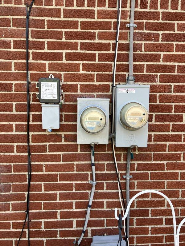 Completed full HVAC system installation including a 70,000 BTU furnace with humidifier and 3-ton air conditioning unit with rear placement. Reconnected existing electrical service, installed exterior condensate drainage system with PVC piping, and obtained mechanical permit for all equipment. System qualified for utility energy efficiency rebate program under AHRI certification number 215664802.