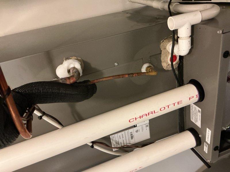 Responded to no-cooling complaint on three-year-old air conditioning system located in upstairs bedroom. Upon inspection, discovered refrigerant leak in evaporator coil assembly. System was low on refrigerant charge, causing warm air discharge from supply registers. Performed leak detection, identified compromised coil, and verified system was still under manufacturer warranty. Documented equipment condition with photos of HVAC components and performed ice test at sink to demonstrate proper refrigerant flow restoration after repair. Recharged system to manufacturer specifications and confirmed proper cooling operation before departure.