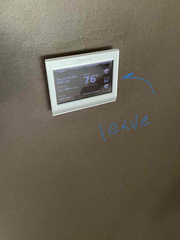 Conducted on-site evaluation for residential air conditioning system replacement. Assessed existing outdoor condensing unit located on rear deck area with electrical service and conduit installation. Documented current Honeywell digital thermostat displaying operational status and humidity readings. Based on property size and cooling requirements, determined appropriate replacement unit sizing in the 2 to 2.5 ton capacity range. Photographed equipment location, electrical connections, and existing HVAC controls for replacement planning and proposal development.
