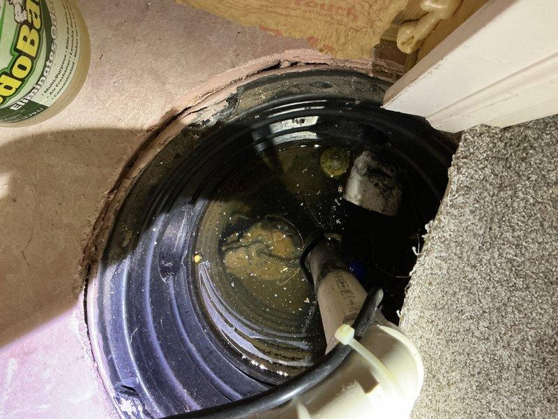 Responded to basement flooding complaint initially suspected to be water heater-related. Upon inspection, determined the issue originated from sump pump system failure rather than the water heater. Found existing sump pump basin filled with sediment-laden water and malfunctioning pump unit unable to discharge accumulated groundwater effectively. Removed failed pump from basin and cleared debris from pit to restore proper drainage capacity. Installed replacement sump pump with new float switch assembly to ensure automatic operation when water levels rise. Tested system operation through multiple cycles to verify proper activation, pumping capacity, and automatic shut-off functionality. Confirmed basement flooding has been resolved and water management system is operating within normal parameters.