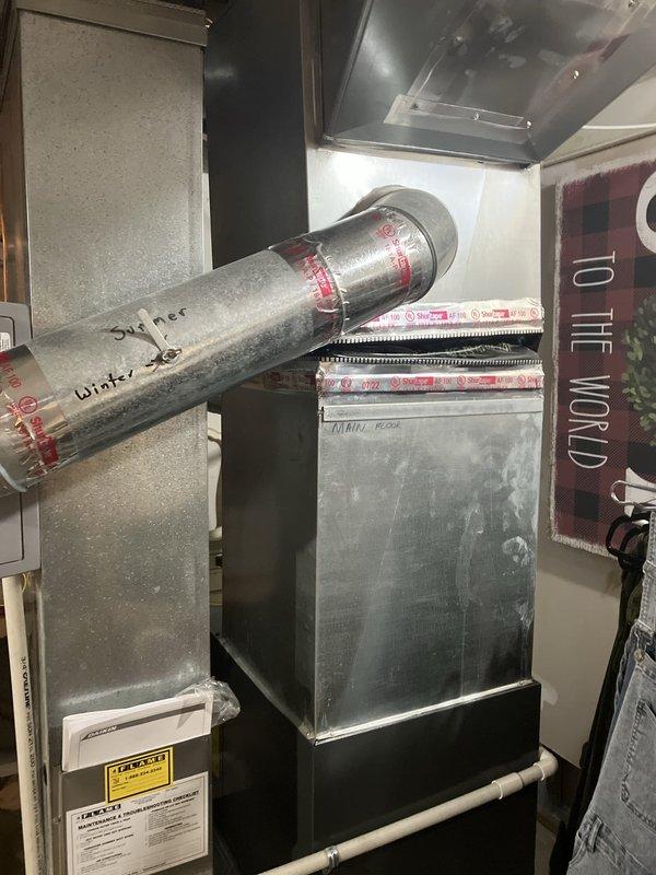 Responded to no cooling condition with outdoor condenser unit not operating while indoor blower continued to run. Performed diagnostic evaluation of split system air conditioning equipment and determined condenser failure required full system replacement. Completed installation of new HVAC system including outdoor condensing unit and indoor air handler with associated refrigerant lines, electrical connections, and ductwork integration in basement mechanical space.