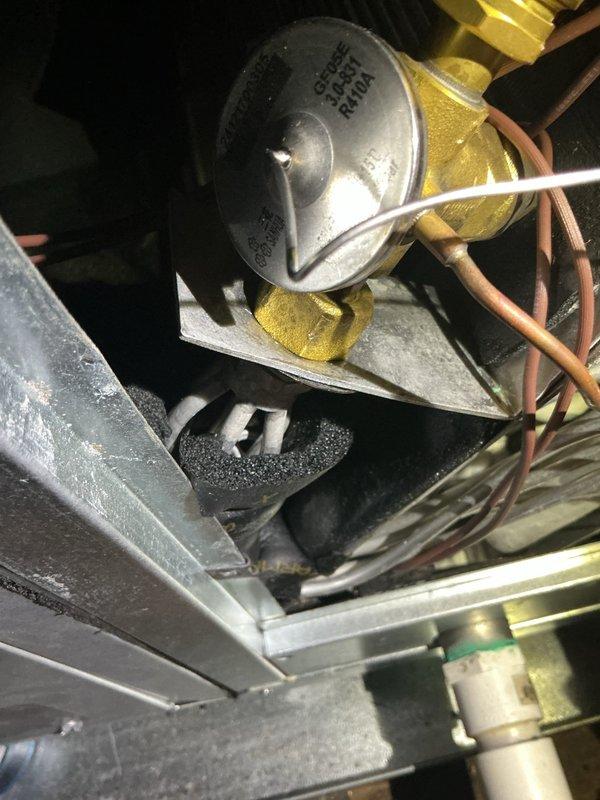 Responded to service call for 3-year-old AC unit experiencing compressor short cycling. Inspected equipment located in attic and backyard areas. Examined refrigerant lines, control components, and system connections. Assessed Cross Super Feed valve assembly and associated copper refrigerant piping for proper operation. Verified mounting brackets, insulation integrity, and mechanical connections throughout the system to identify cause of compressor cycling issue.