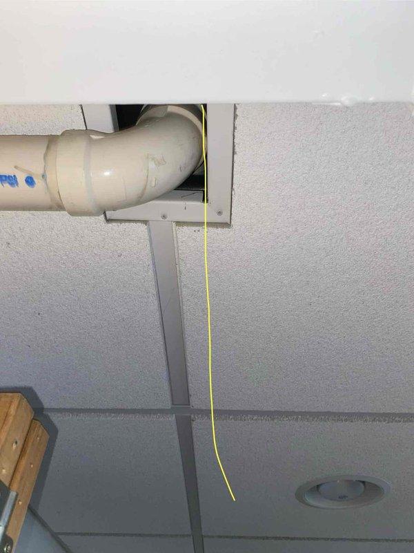 Completed comprehensive estimate for replacement of 10+ year old air conditioning and furnace system located in basement. Assessed existing HVAC equipment, documented current installation including white cabinet-style unit with associated PVC condensate drainage system, and evaluated infrastructure requirements for new system installation. Photographed equipment location, available workspace, existing ductwork connections, and utility access points to provide accurate replacement specifications and equipment recommendations.
