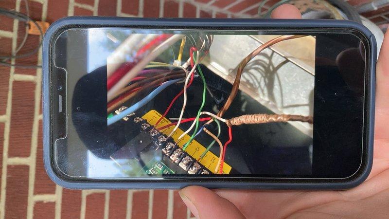Responded to service call for 3-year-old outdoor AC unit experiencing continuous cooling operation and evaporator coil icing issues. Performed diagnostic testing of thermostat control wiring and low-voltage circuit using multimeter to identify fault in thermostat communication. Found stuck contactor relay causing compressor to run continuously regardless of thermostat call. Documented wiring configuration and electrical readings at terminal connections to verify proper voltage and identify control circuit malfunction causing unit to bypass thermostat settings.
