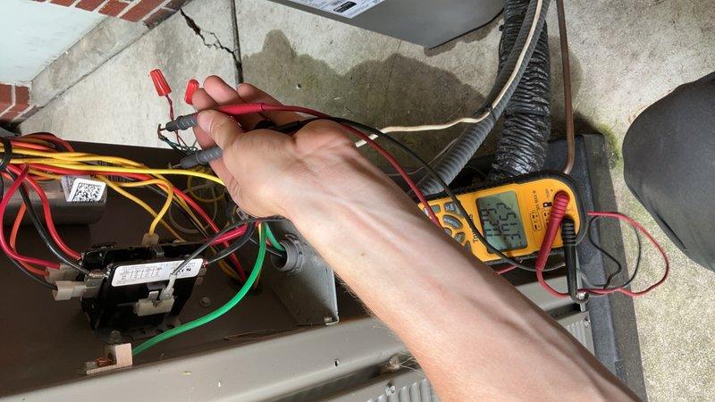 Responded to service call for 3-year-old outdoor AC unit experiencing continuous cooling operation and evaporator coil icing issues. Performed diagnostic testing of thermostat control wiring and low-voltage circuit using multimeter to identify fault in thermostat communication. Found stuck contactor relay causing compressor to run continuously regardless of thermostat call. Documented wiring configuration and electrical readings at terminal connections to verify proper voltage and identify control circuit malfunction causing unit to bypass thermostat settings.