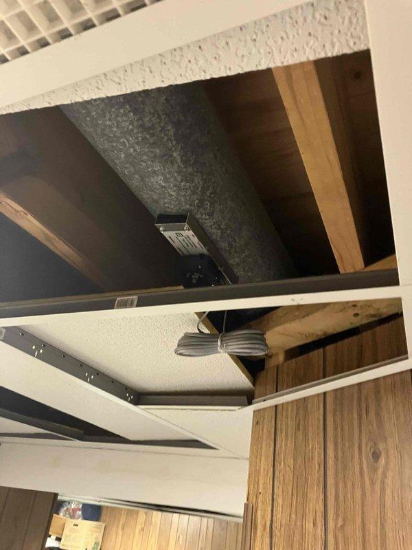 Completed installation of multi-zone HVAC system in residential property. Installed zone control dampers and ductwork in attic space, including mounting control panels and running necessary metal ductwork through existing structural framing. All components were properly secured with metal strapping, electrical connections were made to zone control equipment, and system was tested for proper operation across all zones.