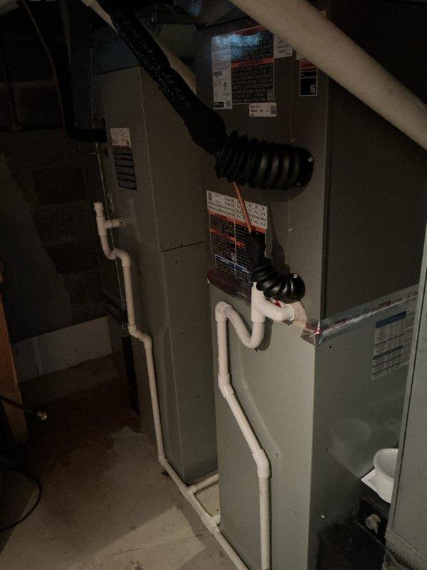Successfully completed installation of 3-ton air conditioning system with new evaporator coil in residential basement location. Coordinated access with property contact, arriving with advance notice as homeowner was out of town. Installed new AC unit and coil per mechanical permit requirements, utilizing R-454B refrigerant system. Connected all refrigerant lines, performed system flush as specified, and completed electrical reconnection. Mounted furnace unit with proper clearances, installed PVC condensate drainage with appropriate pitch and connections, and attached supply and return ductwork using flexible connections. Verified all manufacturer specifications, affixed required warning labels and data plates, and ensured GFCI protection compliance. System tested and operational upon completion with all components functioning within normal parameters.