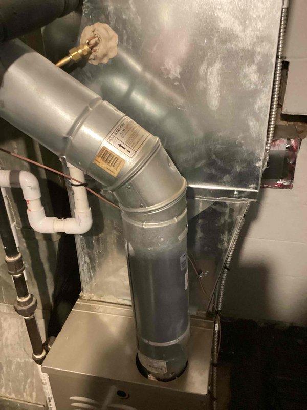 Responded to furnace service request to inspect heat exchanger as requested. Performed comprehensive evaluation of furnace system and associated components in mechanical room. Upon inspection, documented existing HVAC infrastructure including ductwork connections, plumbing lines, and ventilation components. System was operational and maintaining heating capability at time of assessment. Provided estimate for replacement options based on equipment age and condition findings.
