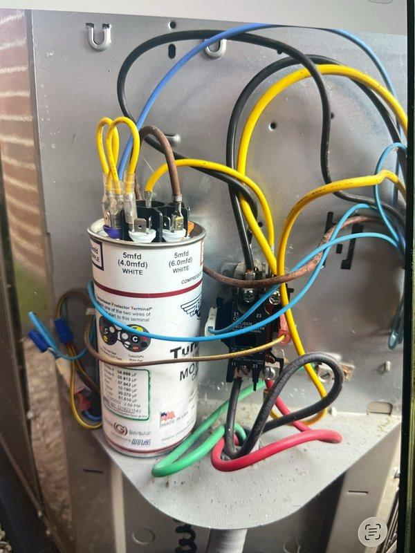 Responded to no cooling complaint on 6-year-old AC unit located in basement. Upon inspection, found failed dual run capacitor preventing compressor operation. Replaced defective capacitor with new unit rated at 5mfd, reconnected all wire terminations, and verified proper system operation. Measured supply air temperature at 54.5°F, confirming restored cooling capacity and normal system function.