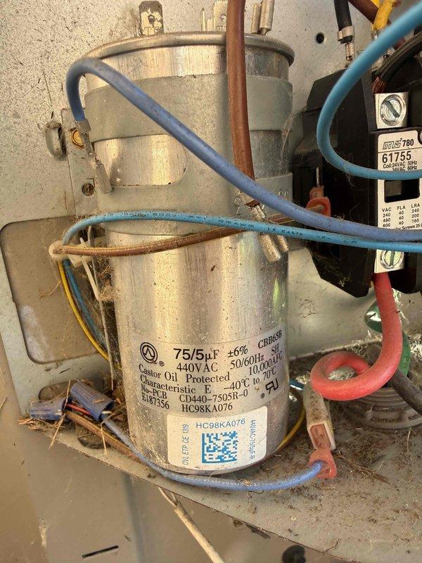 Completed comprehensive Gold AC inspection on 2019 residential air conditioning system. Performed thorough evaluation of outdoor condensing unit and indoor air handler components located in basement. Inspected dual-run capacitor rated at 75/5μF 440V AC, verified electrical connections, and assessed blower motor assembly and refrigerant lines. System operating within normal parameters with no immediate service requirements identified. Documented equipment condition through photographic records showing outdoor unit positioned on concrete pad with proper electrical disconnect and indoor components including capacitor and associated wiring harness.